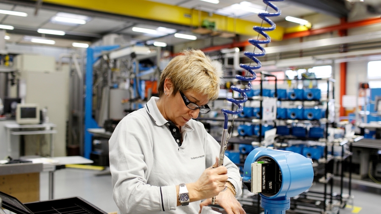 Endress+Hauser Flow in Reinach, Switzerland, woman working in production